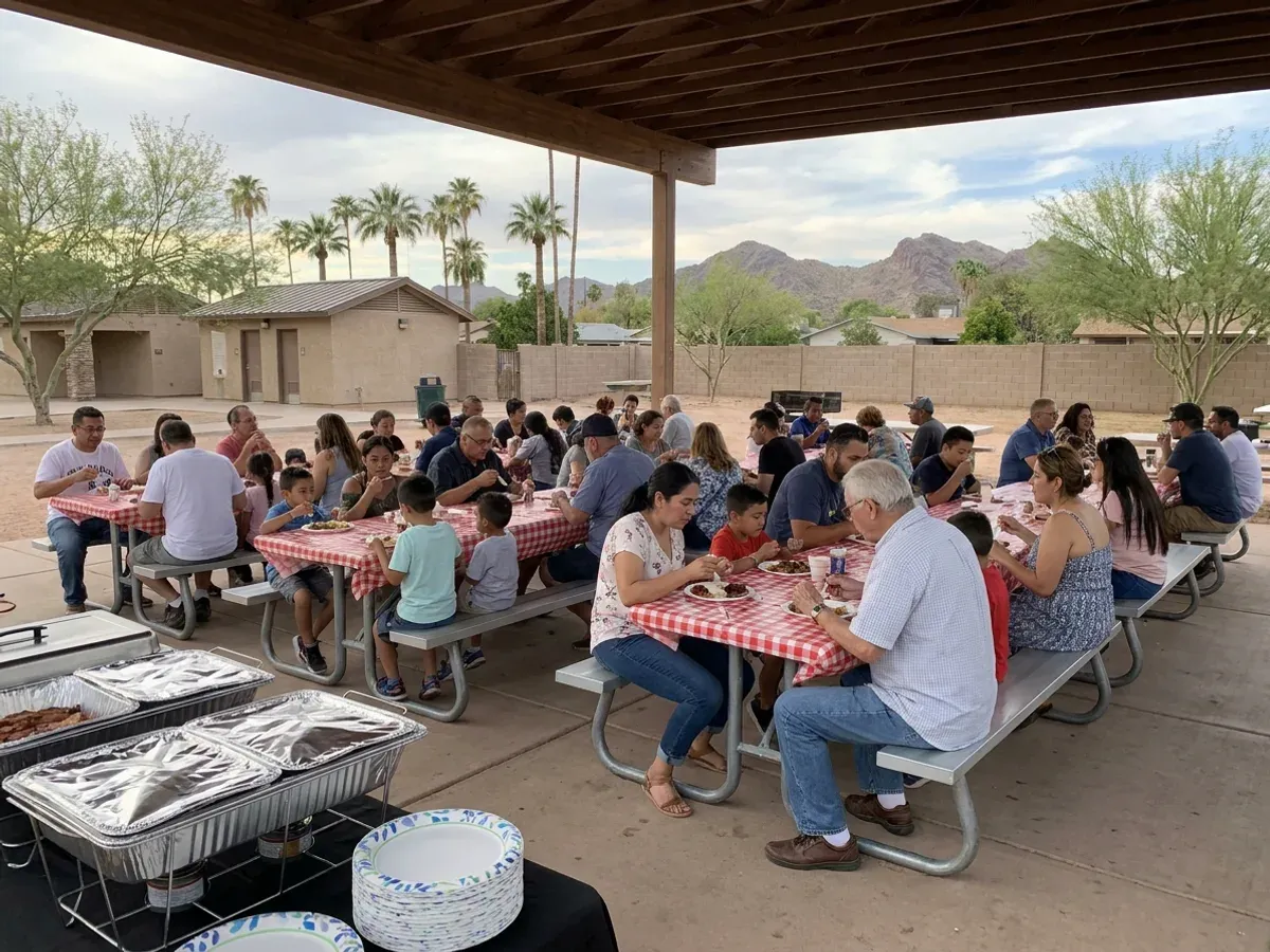 Large community BBQ gathering with long tables and a happy crowd